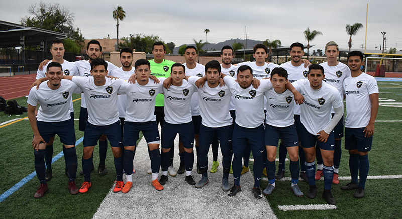 Rebels SC Adult team posing before a match