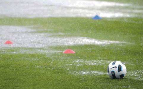 A soccer field during a raining day