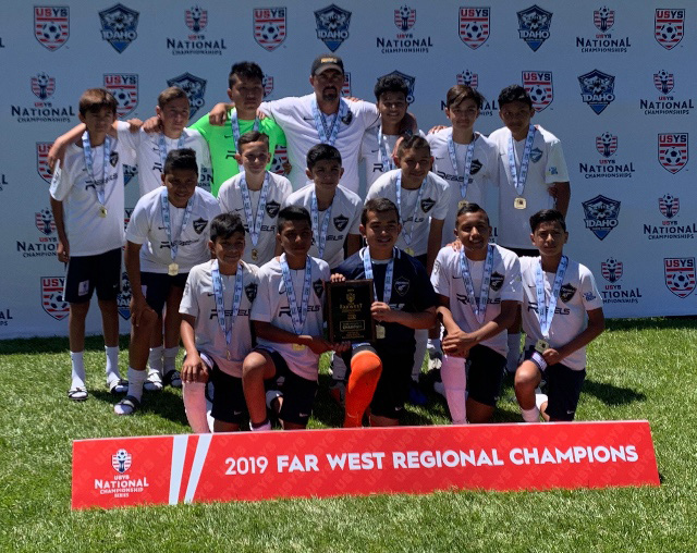 Rebels SC Boys 2006 posing with coach Aguilar Camello after winning the Far West Regional cup