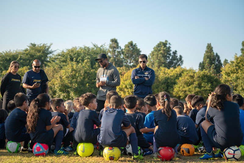 Coaches and kids during a Jr Academy practice.